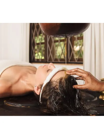 Hair fall is often a result of an aggravated Pitta dosha, stress, or poor nutrition. My Ayurvedic hair care treatments focus on the root cause. I use herbal oils with Bhringraj and Amla and therapies like Shirodhara to improve scalp circulation, strengthen follicles, and reduce hair loss effectively.