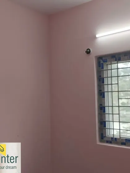 The same room with light pink walls, showing the clean finish around the window.