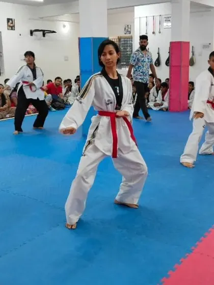 Students practicing their forms, which combine blocks, strikes, and kicks.