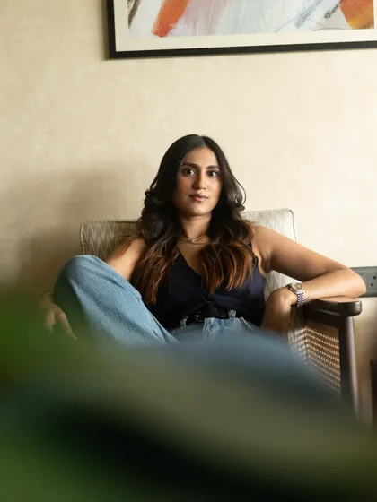 A relaxed, seated portrait that feels both casual and composed. We used the natural elements of her environment to make the photos feel authentic to her brand.
