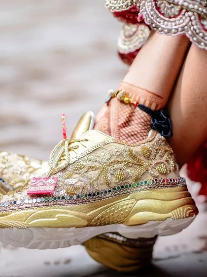 A close-up of the bride's stylish and comfortable wedding sneakers.