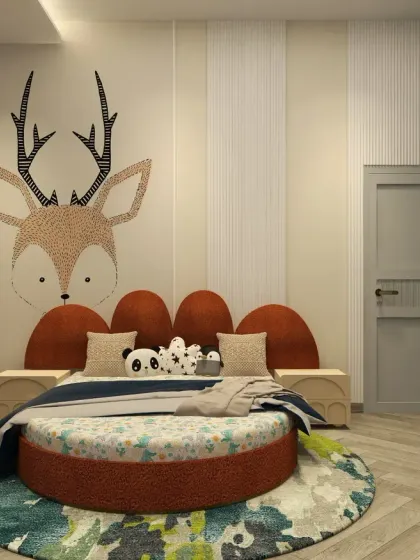 This kid's bedroom for a one-year-old boy features a playful round upholstered bed with a deer-themed wallpaper accent, designed to be both fun and safe.