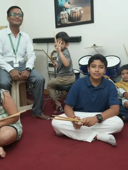 A group of our drum students of various ages with their teachers. Our classes foster a sense of community, where students learn and grow together.