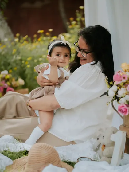 A mother's love. This tender moment between a mother and her daughter during their outdoor picnic session is what memory-making is all about.
