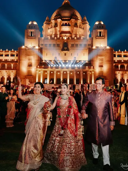 The bride's grand entrance with her parents at the Umaid Bhawan Palace, a powerful moment featured in our ELLE India spread.