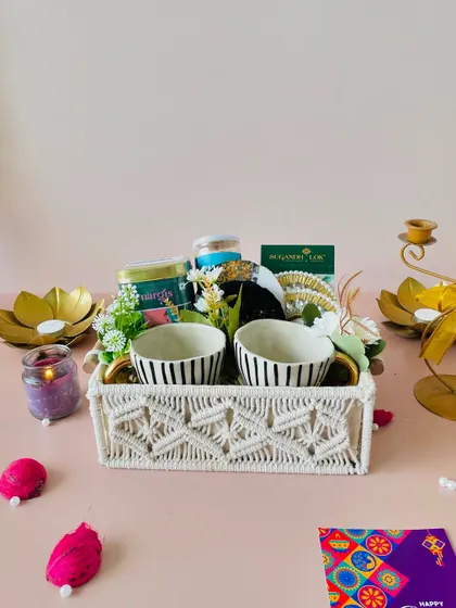 A full view of the macrame tray hamper, surrounded by festive decor, showcasing its potential as a high-end Diwali gift.
