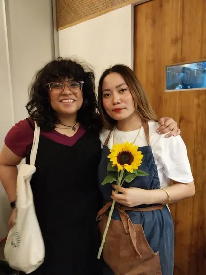 One of our founders with a happy customer. We have formed so many friendships and shared so much love in this space, and we are grateful for every connection.