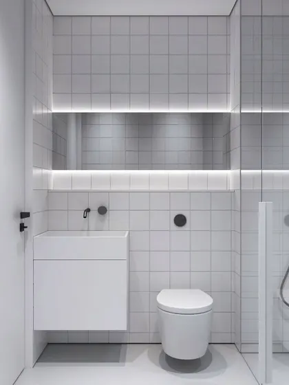 An alternate view of the minimalist toilet concept, showing the clean lines and the ambient glow from the integrated lighting.