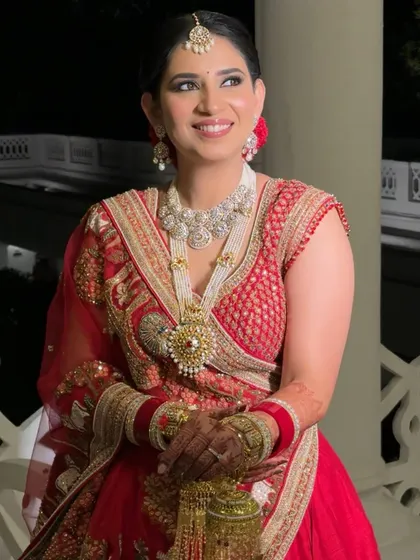 The perfect candid moment. Manika's smile shines, enhanced by a soft, timeless makeup look that highlights her natural beauty without overpowering it.