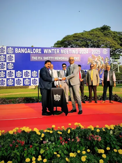 Mr. K. Harish Nayak presents The P.V. Shetty Memorial Trophy to the winning connections of Finley.