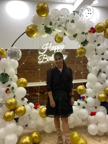 Another photo of the client enjoying her chic and elegant birthday party backdrop.