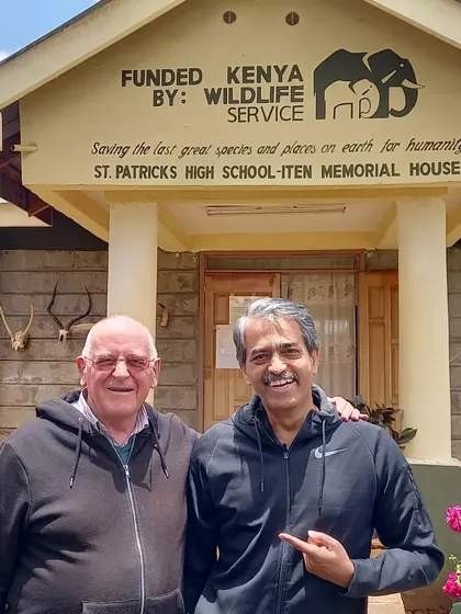 With Brother Colm O'Connell at St. Patrick's High School in Iten, Kenya. He was very curious to learn about how I use technology in my training programs.