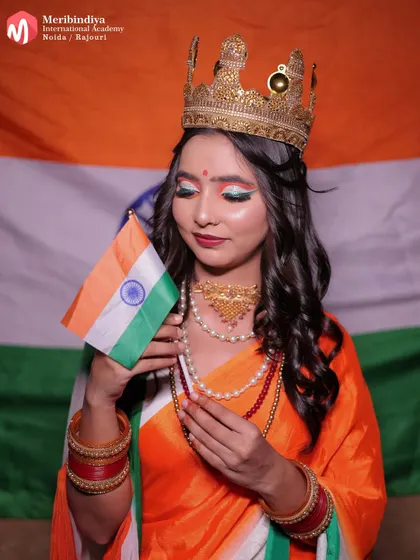 The model holds the Indian flag, her hair styled elegantly to complement the 'Bharat Mata' inspired look.