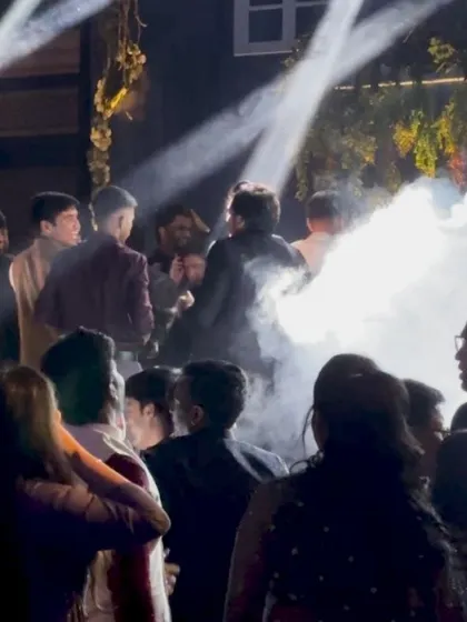 The party doesn't stop. This shot captures the high energy on the dance floor, with smoke effects and dramatic lighting keeping the vibe going.