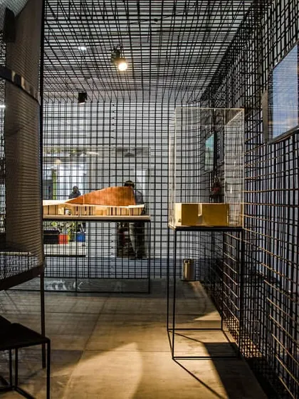 An exhibition pavilion constructed from a porous metal grid. This project explores how a simple, modular material can be used to define space, guide movement, and create complex visual layers through the interplay of light and shadow.