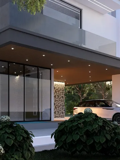 The entrance of an exquisite modern villa, featuring a mix of stone cladding and smooth white walls under a welcoming portico. This design focuses on creating a sophisticated first impression.