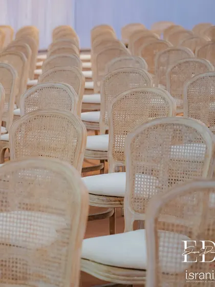 The texture and pattern of the natural cane chairs provide a beautiful, organic element to the decor. This choice reflects a commitment to sustainable and mindful design.