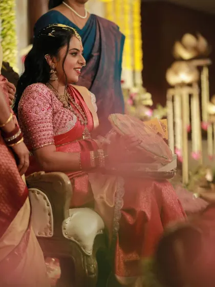 A joyful, candid photo of a client during her wedding festivities. The makeup is holding up beautifully, and her happiness is radiating.