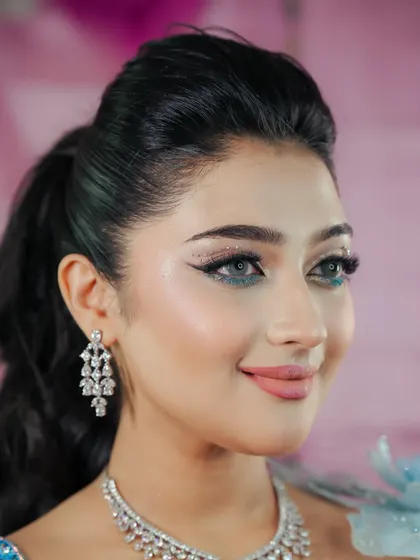 A close-up of this dreamy blue eyeshadow look. The glitter and sharp wing make it perfect for a cocktail party or reception.
