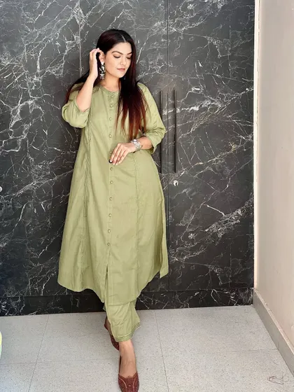 A simple and elegant olive green kurta and pant set. The A-line cut and button details make it a perfect choice for comfortable daily wear.