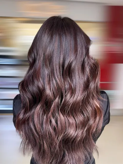 Another angle of this stunning chocolate balayage, showing how the color looks against a different background. The warm tones are rich and create a beautiful contrast, making the hair appear full and healthy.