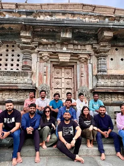 A group sits on the steps of an ancient temple, a perfect spot to rest and soak in the history.