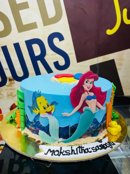 Under the sea with Ariel and Flounder on this 1.5kg Little Mermaid cake, complete with edible sand and seaweed.