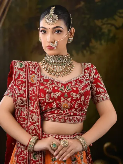 Another angle of this stunning North Indian bridal look, highlighting the rich colors and detailed embroidery.