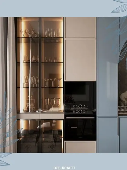 We design beautiful and functional storage, like this glass-front cabinet with integrated lighting, perfect for displaying fine glassware while keeping it organized.