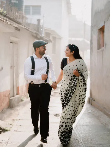 Walking together down a narrow, sunlit alley. This shot has a beautiful, soft light and a feeling of quiet intimacy.