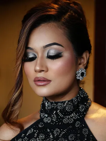 When in doubt, go bold. A close-up of these fierce and fabulous smoky eyes. The silver glitter adds a touch of drama to the classic black smokey look.