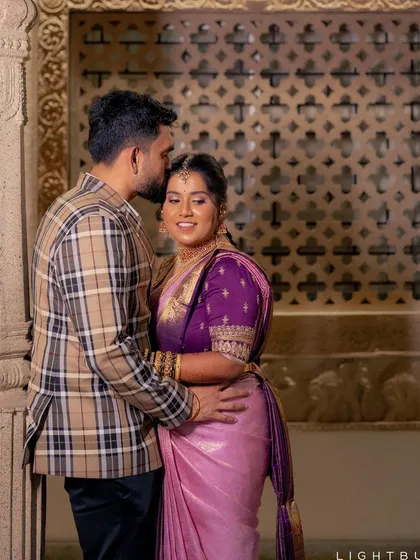 A sweet, intimate moment between the bride and groom. Her radiant smile and glowing makeup are the highlights of this beautiful engagement look.
