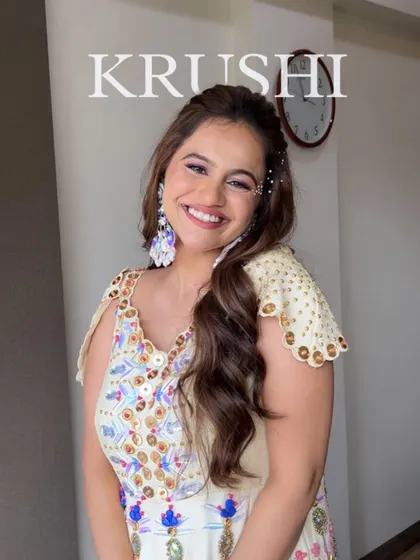 A cute and candid shot of the Haldi bride. Her joyful smile is the best part of this look, which is all about fresh skin and playful details.