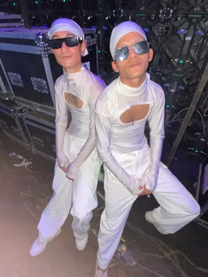 Twinning with my dance partner backstage. Our coordinated look is part of our powerful duo and crew performances.