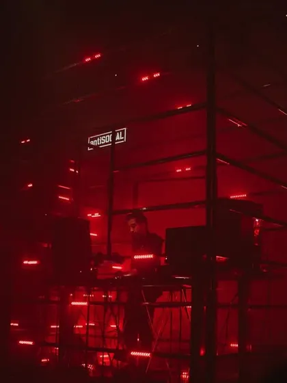 I love playing in unique settings. Here I am inside a custom LED cage at a show in Bombay, surrounded by red lights. This kind of immersive audio visual setup helps me build a deep, hypnotic techno journey for everyone in the room.