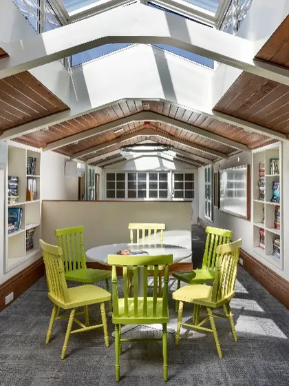Another view of the repurposed 1920s attic, now a state-of-the-art workspace. The design prioritizes natural light and an open feel, making a once dingy and uninhabitable space both functional and inspiring for the staff.