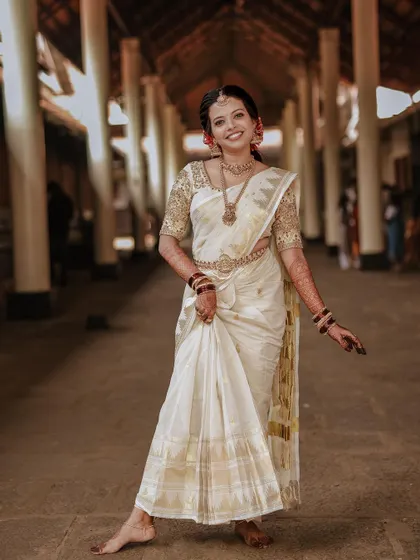 A full-length portrait of the bride, her pose confident and joyful.