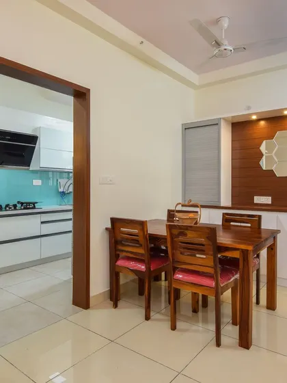 This view shows the dining area in relation to the kitchen entrance, highlighting how our designs create a cohesive flow between different spaces in the home.
