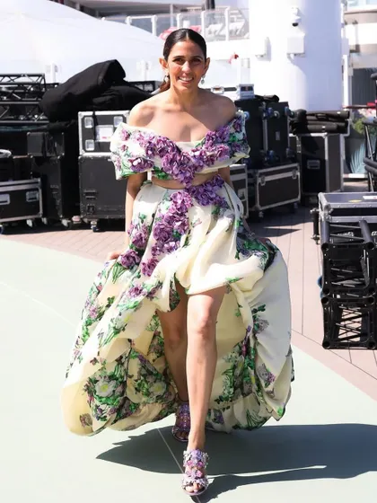 La dolce vita! For a daytime event on a cruise in Italy, we chose this stunning floral off-the-shoulder gown by Yara Shoemaker. The high-low hem and 3D floral details felt fresh, romantic, and perfect for the setting.