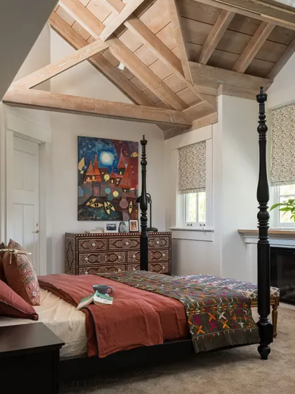 This master bedroom in Saratoga, California, is a sanctuary of calm and character. The four-poster bed creates a classic focal point, while the exposed wooden beams on the ceiling add a sense of rustic elegance. It’s a space that balances grand architectural features with the intimate, personal details that make a room feel like home.