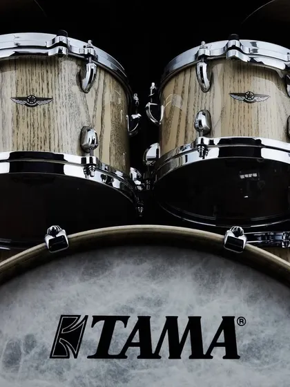 The Tama STAR Walnut kit in an Antique White Chestnut finish. This close-up highlights the beautiful natural grain pattern of the chestnut outer ply.