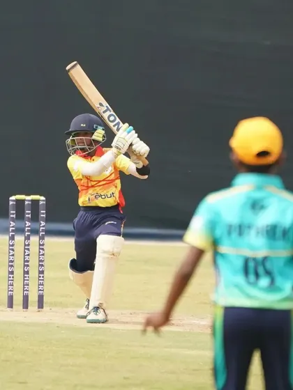 A batsman at the crease, ready to face the bowler, showcasing the confidence and technique of our young players.