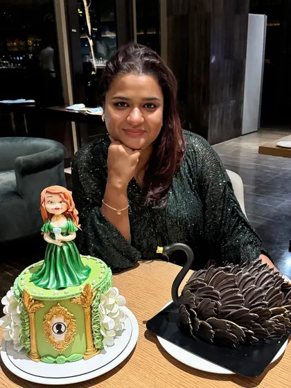 A special birthday celebration with two custom cakes. One features a princess theme, while the other is a stunning black swan, both designed for the birthday girl.