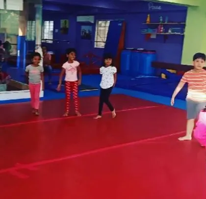 Our "Good Friends" class participating in the "Number Tumblers" theme. These images show the group learning advanced math and tumbling skills through warm-ups, stretches, and games.