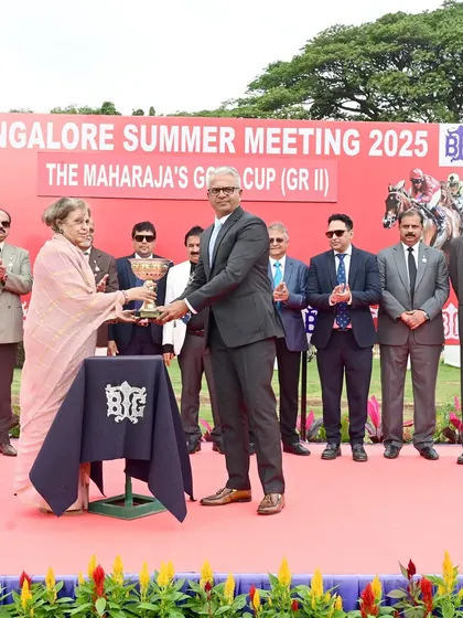 Dr. Pramoda Devi Wadiyar presents The Maharaja's Gold Cup (GR II) to the winning connections of Positano.