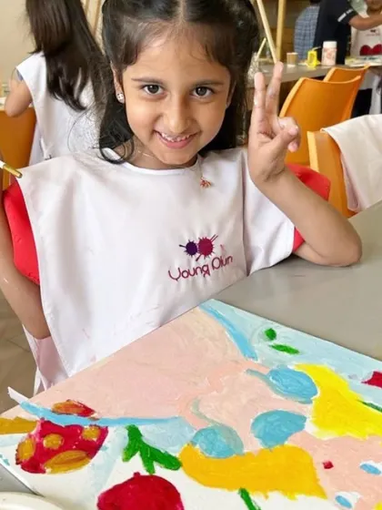 A happy artist with her finished "Alice in Wonderland" painting. Our parties are designed to be fun and build confidence, leaving every child with a sense of accomplishment.