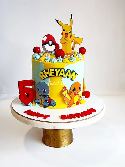 Gotta catch 'em all! A fun and colorful Pokemon cake for a 5th birthday, featuring Pikachu and other favorite characters. A perfect treat for any young Pokemon trainer.