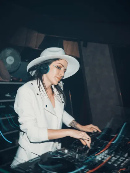 In the zone, mixing tracks at J Club. The light trails show the movement and energy of the night.