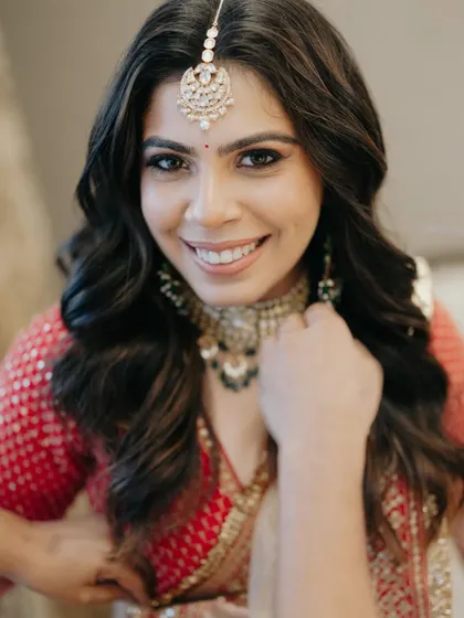 A bright and joyful close-up of the bride, her beautiful smile lighting up the frame.