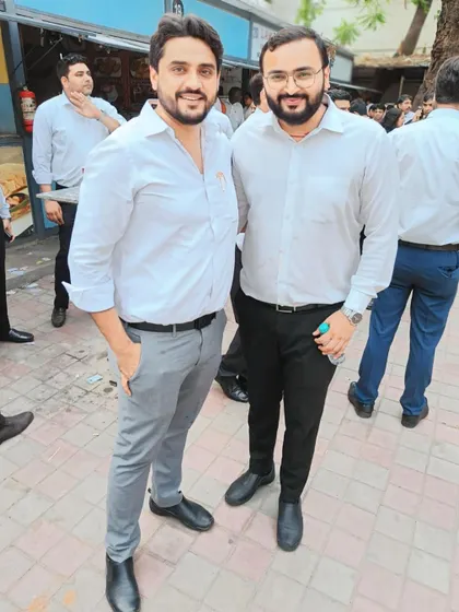 A simple, warm moment with a colleague. These personal connections are the bedrock of our professional lives.
